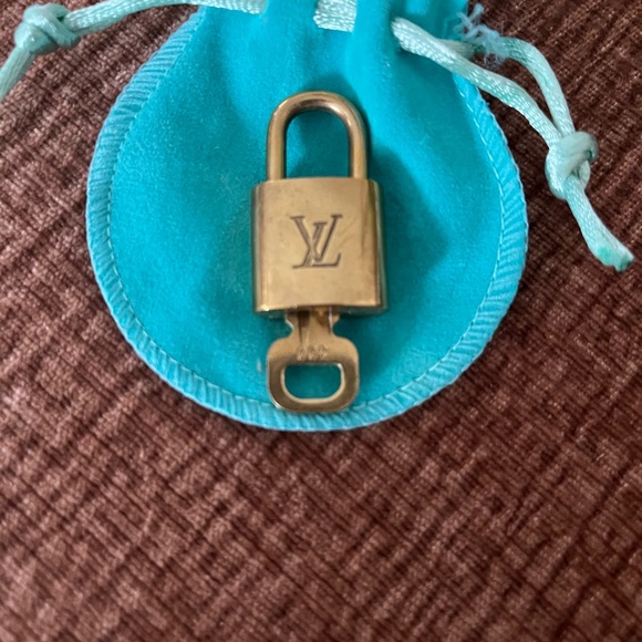 Louis Vuitton Gold Padlock with Turquoise Pouch - Picture 1 of 2